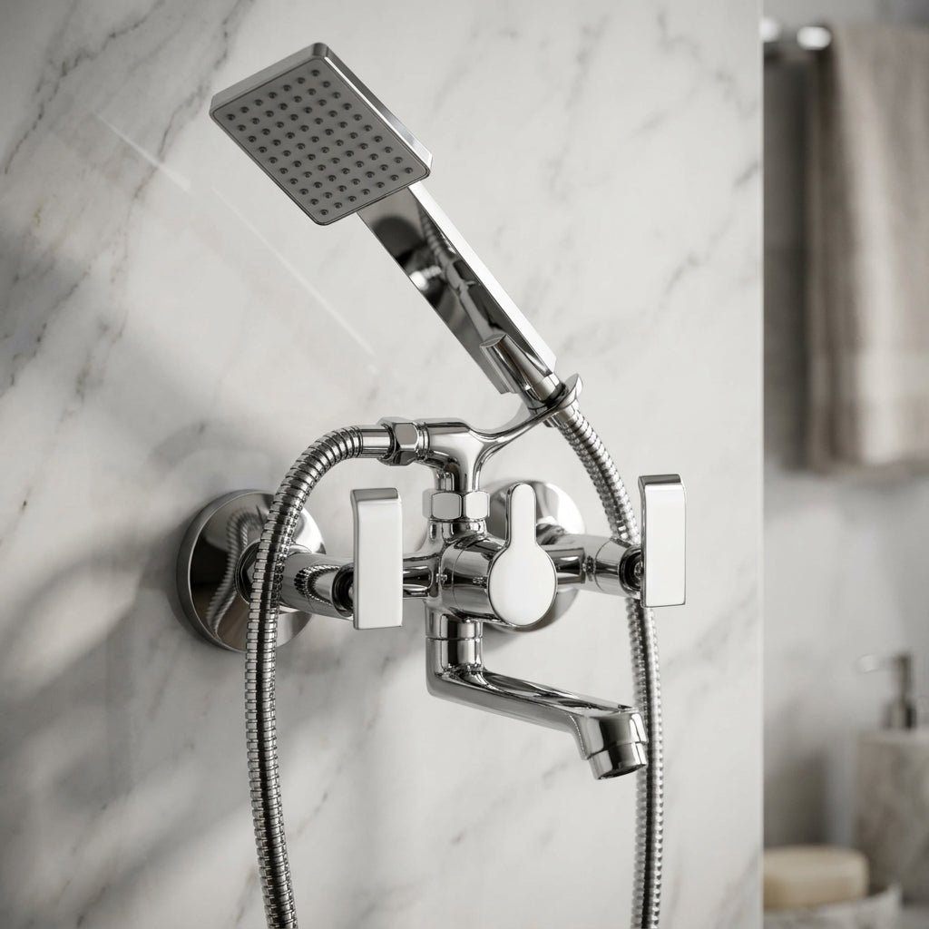 Orion wall mixer with 3-function hand shower in full brass finish by Kamal, mounted on bathroom wall with sleek design.